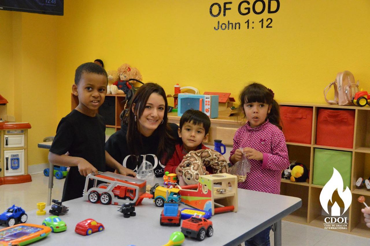 Kids learning with teacher in small classroom